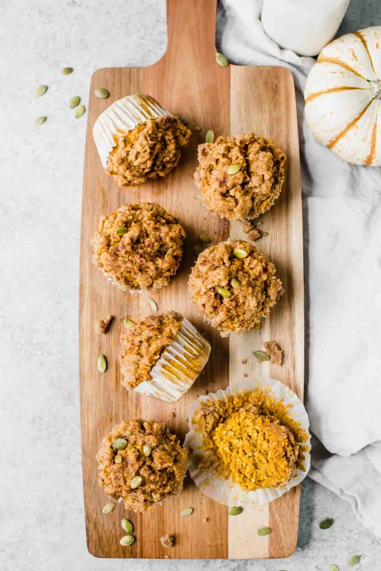 Healthy pumpkin muffins on a cutting board.