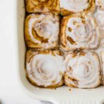 Close up of Vegan Cinnamon Rolls in a baking dish.