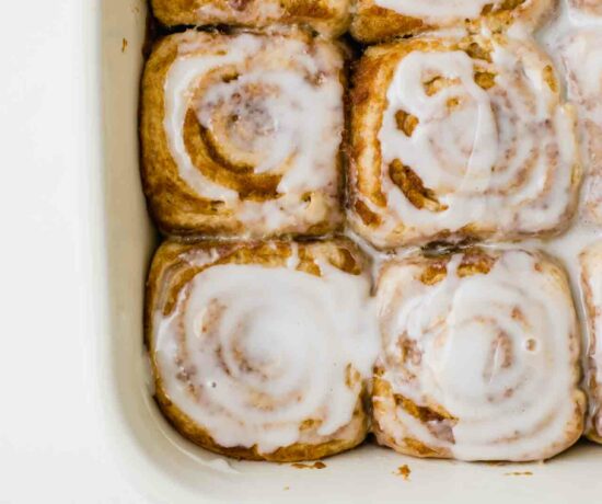 Close up of Vegan Cinnamon Rolls in a baking dish.
