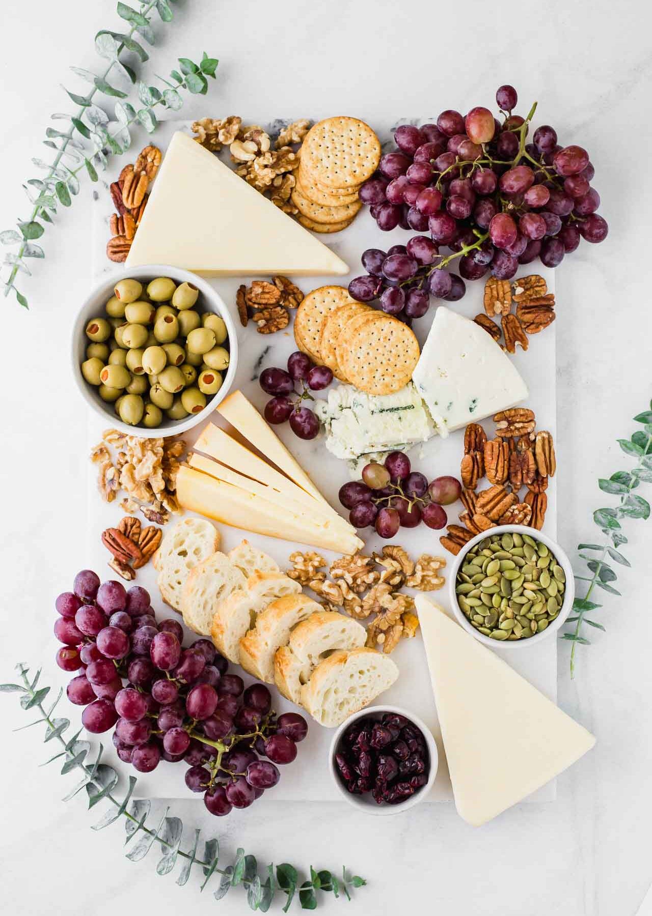Fall-inspired cheese board with eucalyptus.