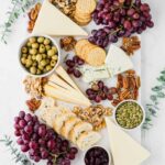 Fall-inspired cheese board with eucalyptus.