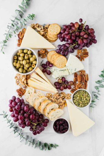 Fall-inspired cheese board with eucalyptus.