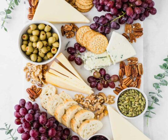 Fall-inspired cheese board with eucalyptus.