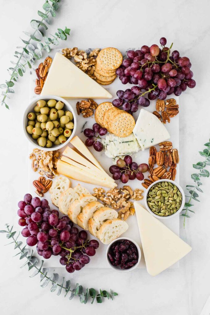 Fall-inspired cheese board with eucalyptus.