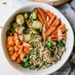 Fall Harvest Bowls recipe on a marble background.