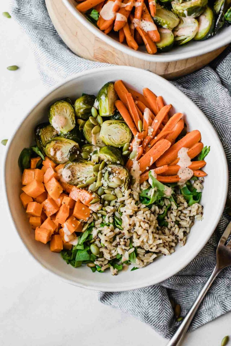 Fall Harvest Bowls recipe on a marble background.