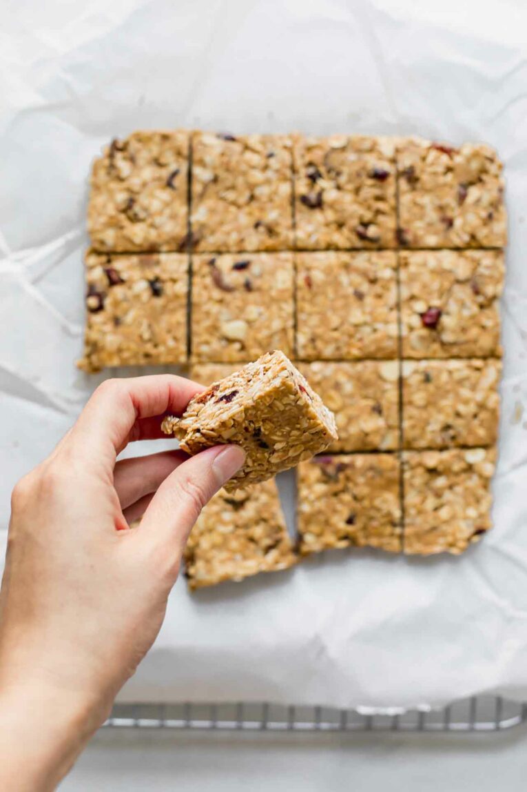 Hand holding a healthy oatmeal bar.