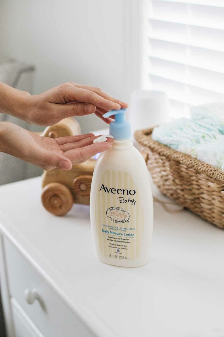 Aveeno Baby lotion in nursery changing area.
