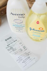 Baby lotion and wash products with a receipt.