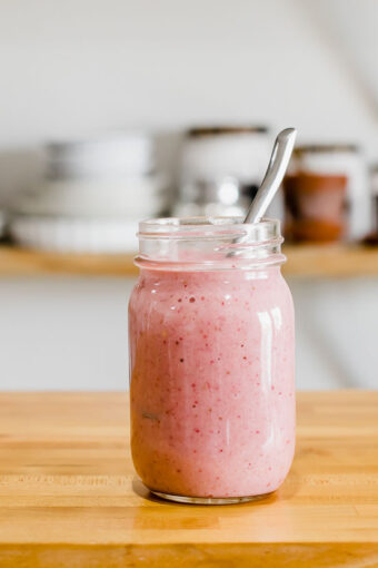 Strawberry smoothie on a counter top.