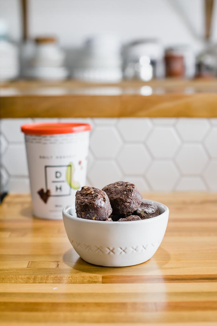 Daily Harvest cacao bites in a bowl on a countertop.