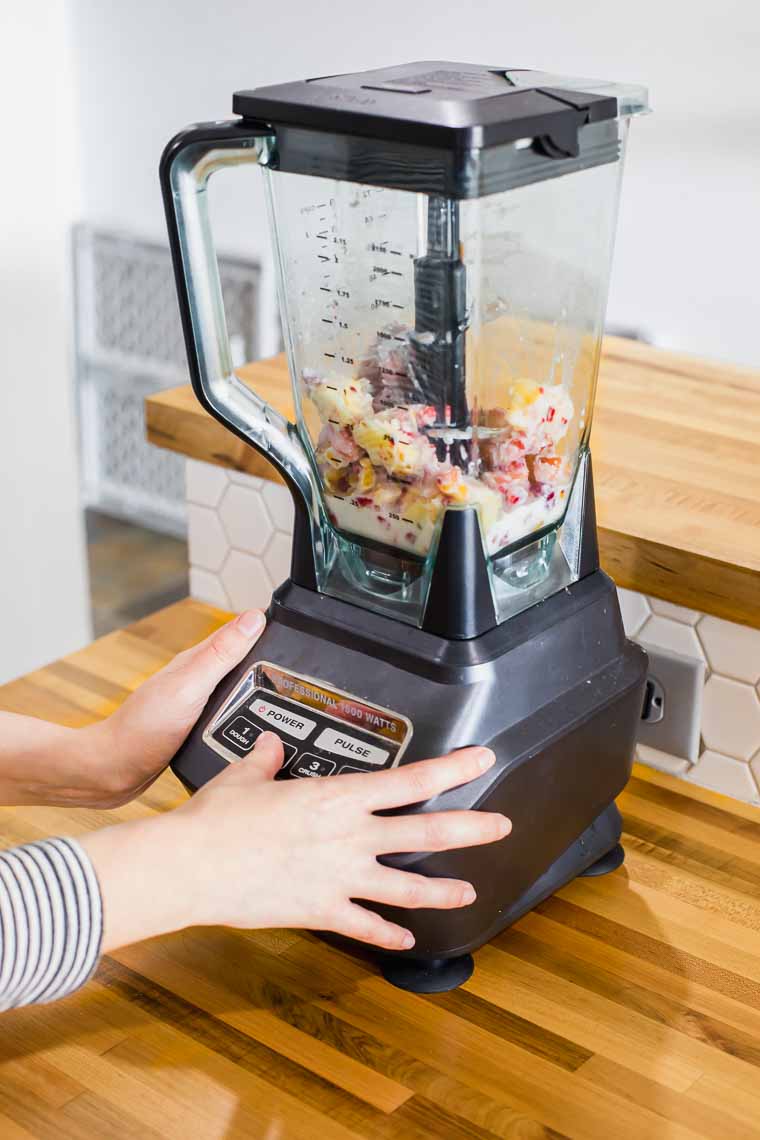 Smoothie ingredients in a blender before blending.