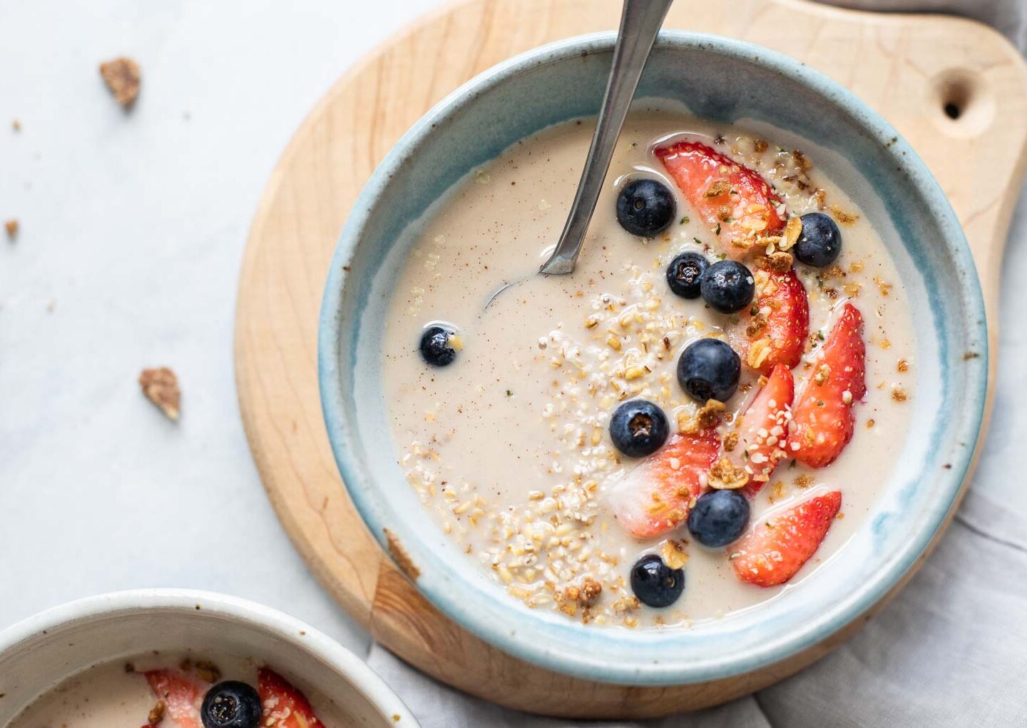 Top shot of steel cut overnight oats with berries and milk.