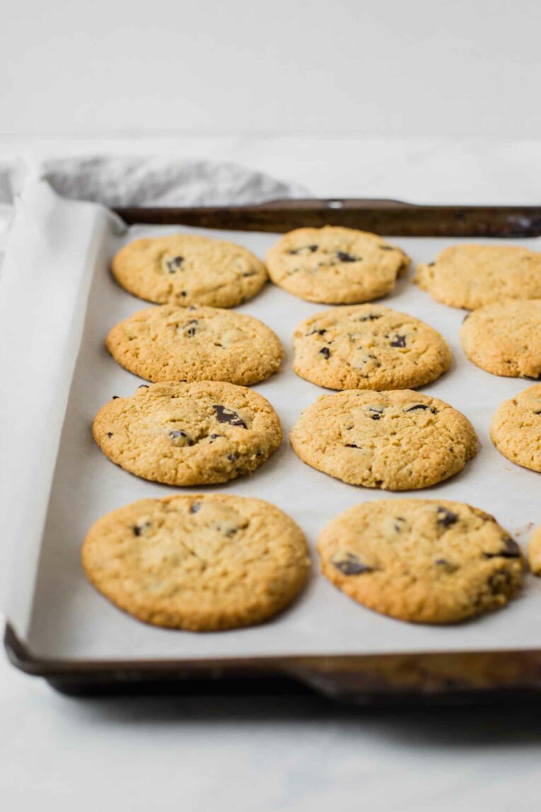 Angled shot of baked chocolate chip cookies.