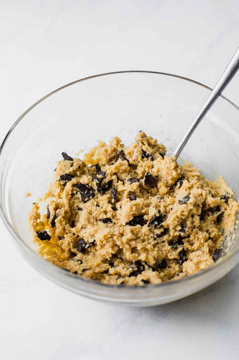Almond flour cookie dough with chocolate chips in a mixing bowl.