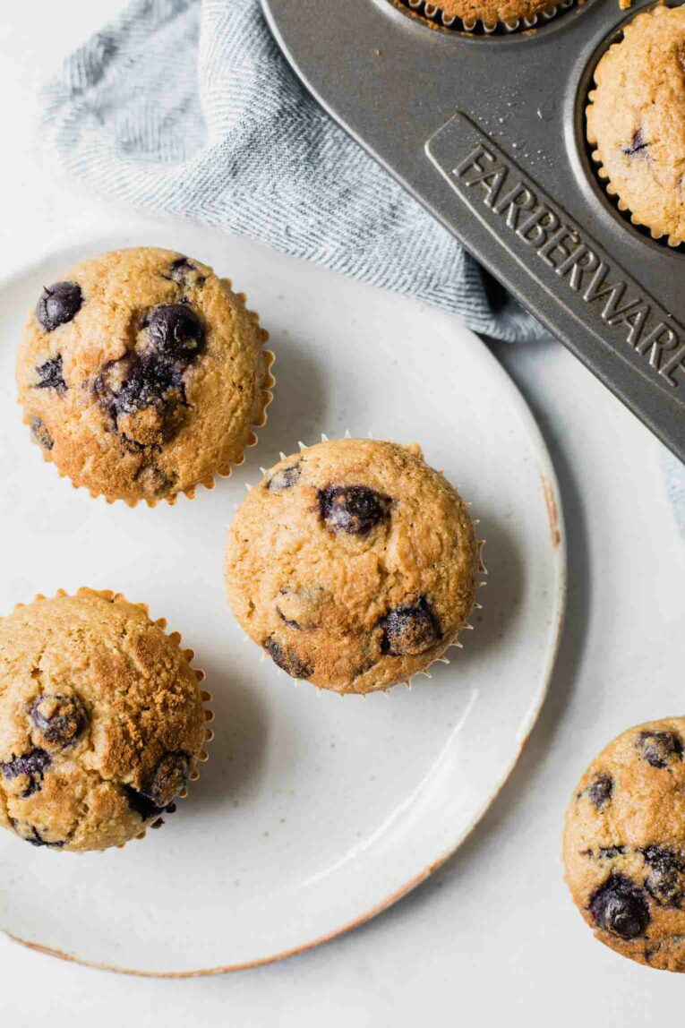 Top shot close up of Blueberry Quinoa Muffins on a white plate.