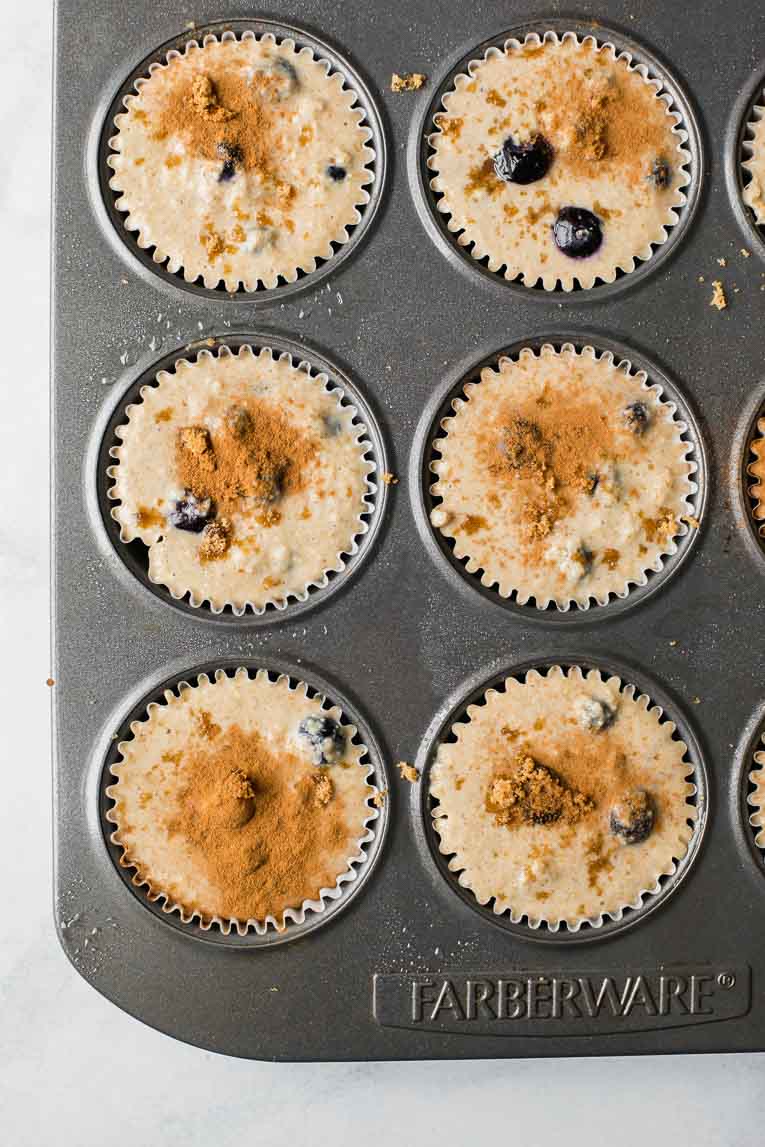Blueberry Quinoa Muffins batter poured into a muffin tin.