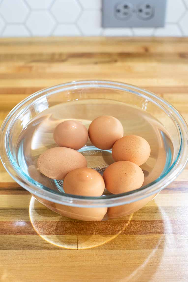 Hard boiled eggs in a bath of cold water.