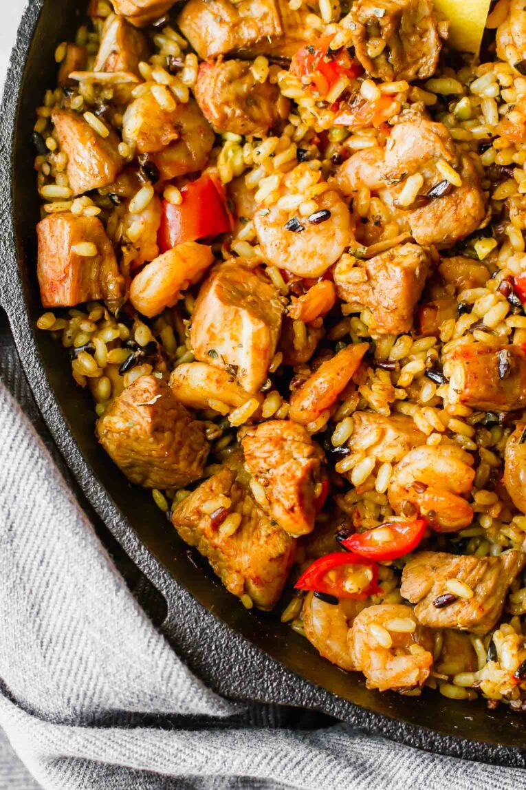 Close up of Spanish paella in a skillet.