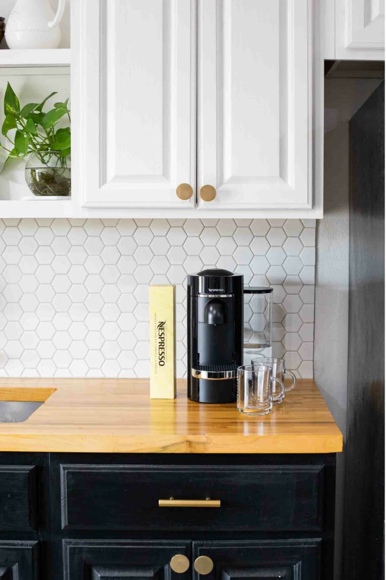 Nespresso products on a butcher block countertop.