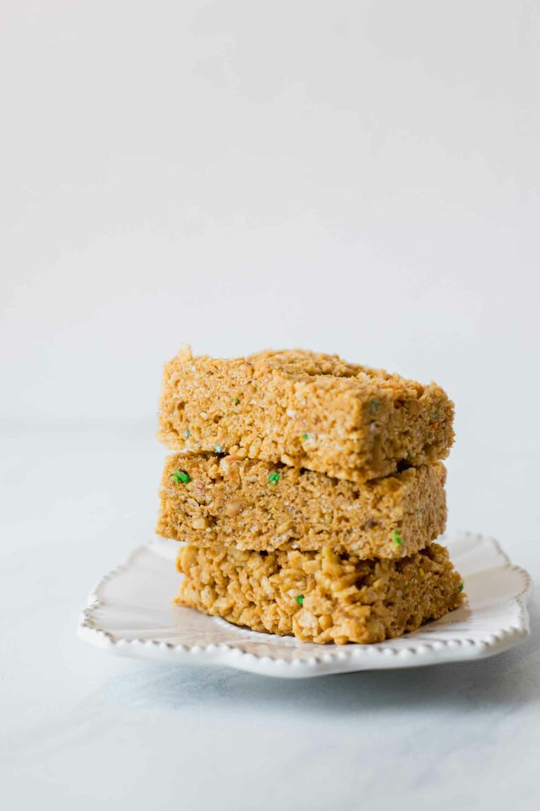 Stacked rice krispie treats on a plate.