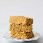 Across shot of healthy rice krispie treats stacked on a plate.