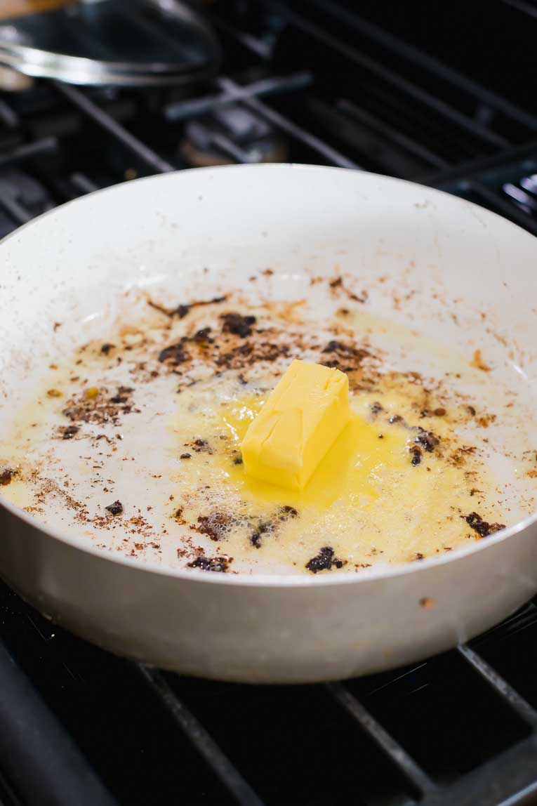 Butter being melted in a saucepan.
