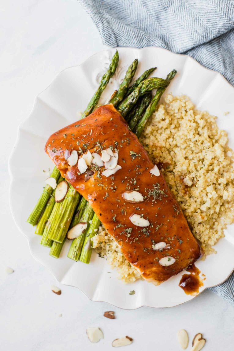 Top shot of maple barbecue salmon on quinoa and asparagus.
