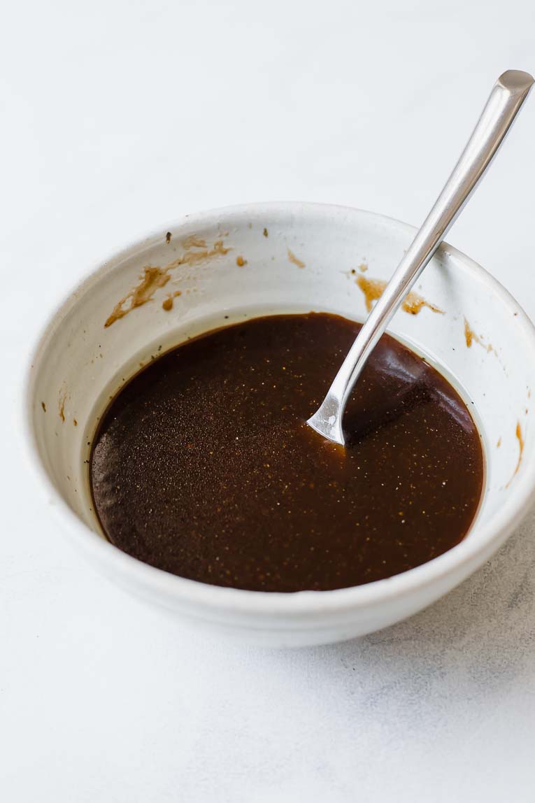 Barbecue sauce in a small white bowl.