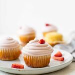 Across shot of Strawberry Lemonade Cupcakes on a white plate.