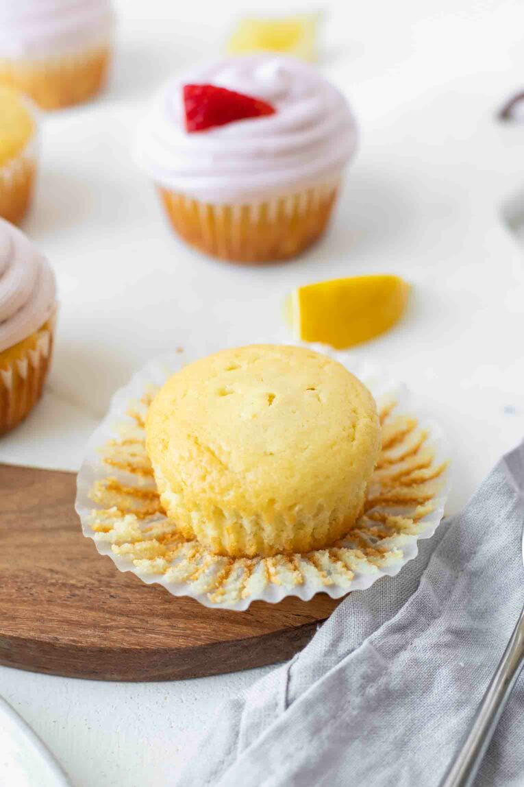 Angled close up shot of lemon cupcake without icing.
