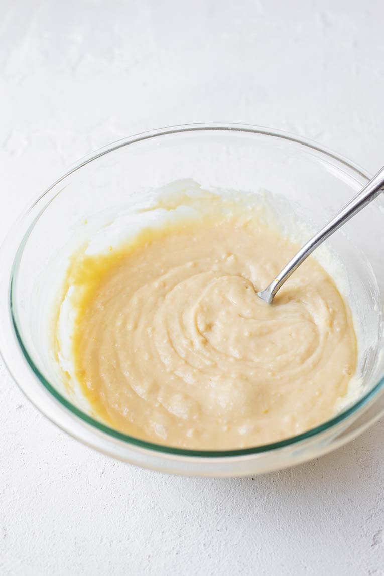 Strawberry lemonade cupcake batter in a glass mixing bowl.