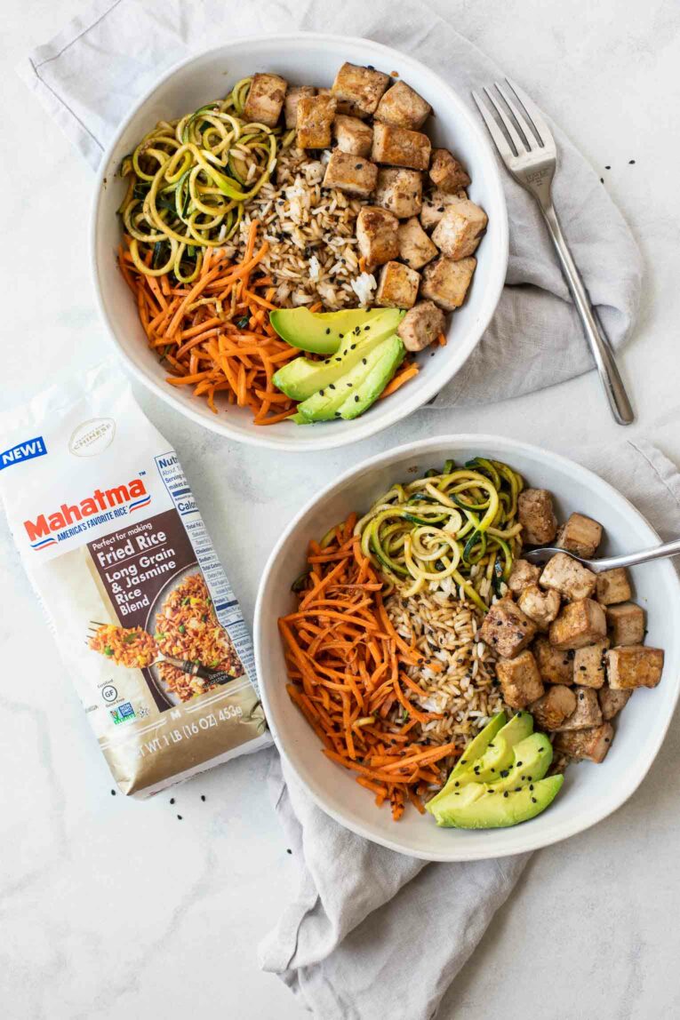 Two Asian Tofu Rice Bowls next to a bag of Mahatma Fried Rice.