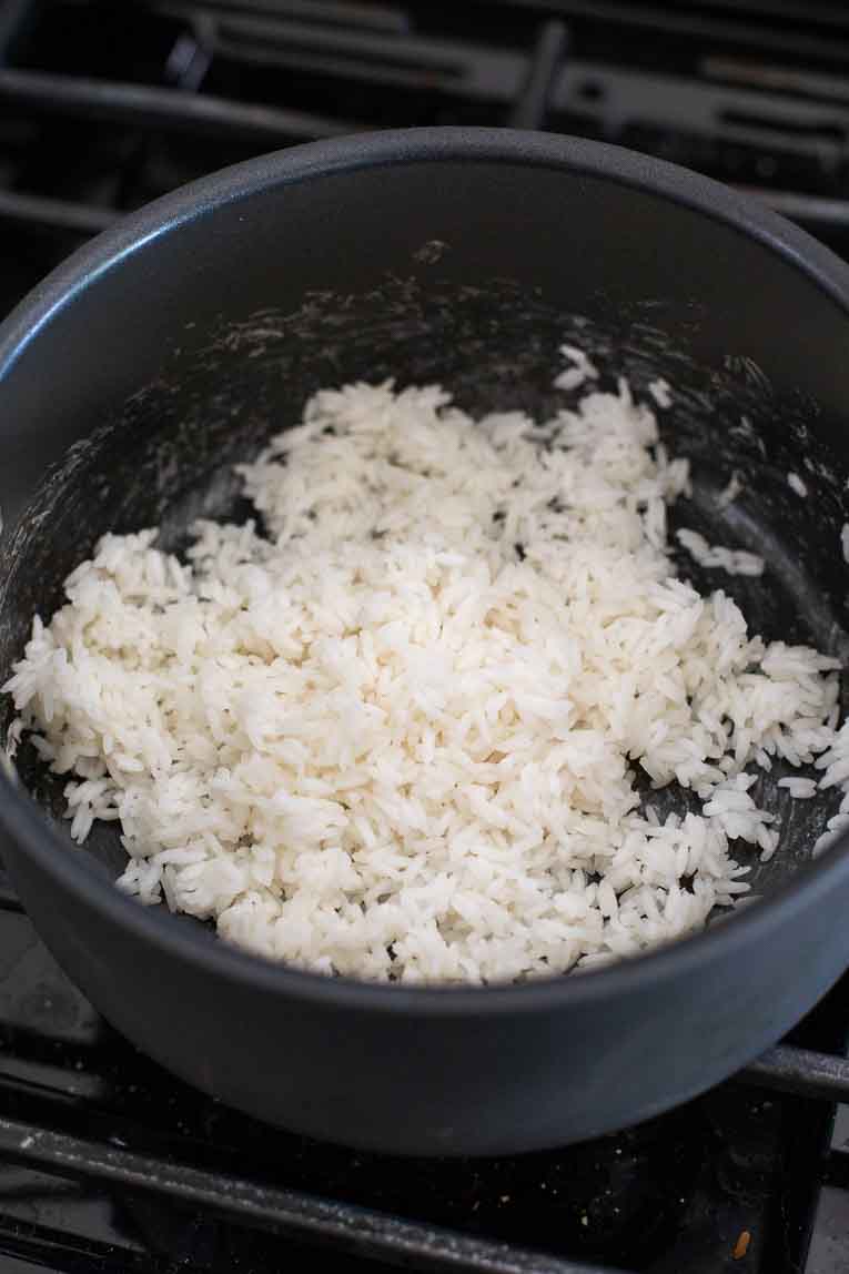 Fried rice being cooked in a pan.