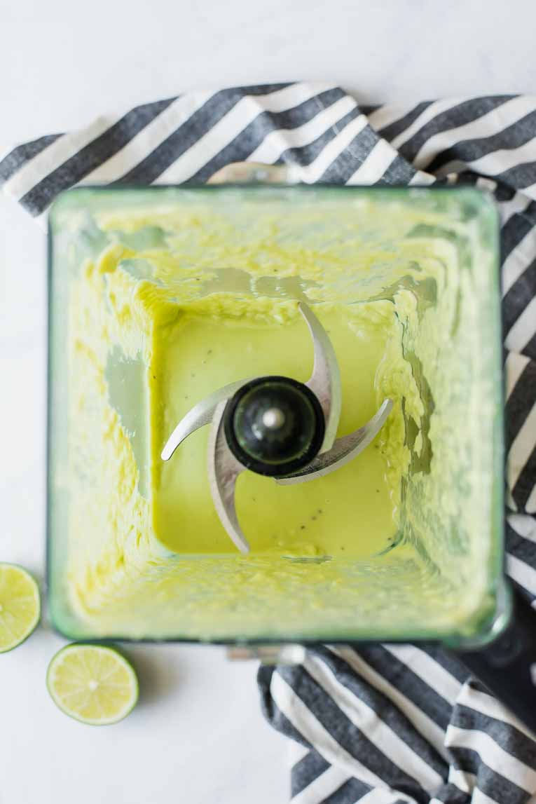 Avocado, lime, and yogurt blended in a blender.