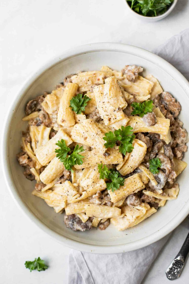 Top shot of Creamy Mushroom Sausage Rigatoni in a white bowl.
