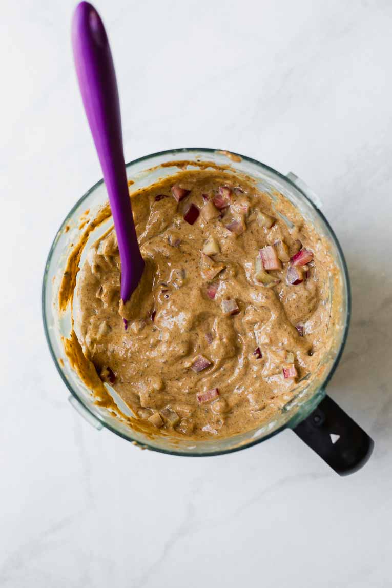 Gluten free muffin batter in a food processor with rhubarb.