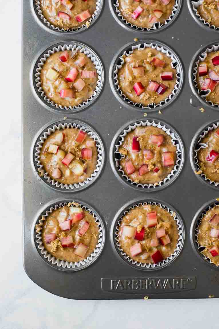 Gluten-Free Healthy Rhubarb Muffins batter in a lined cupcake pan.