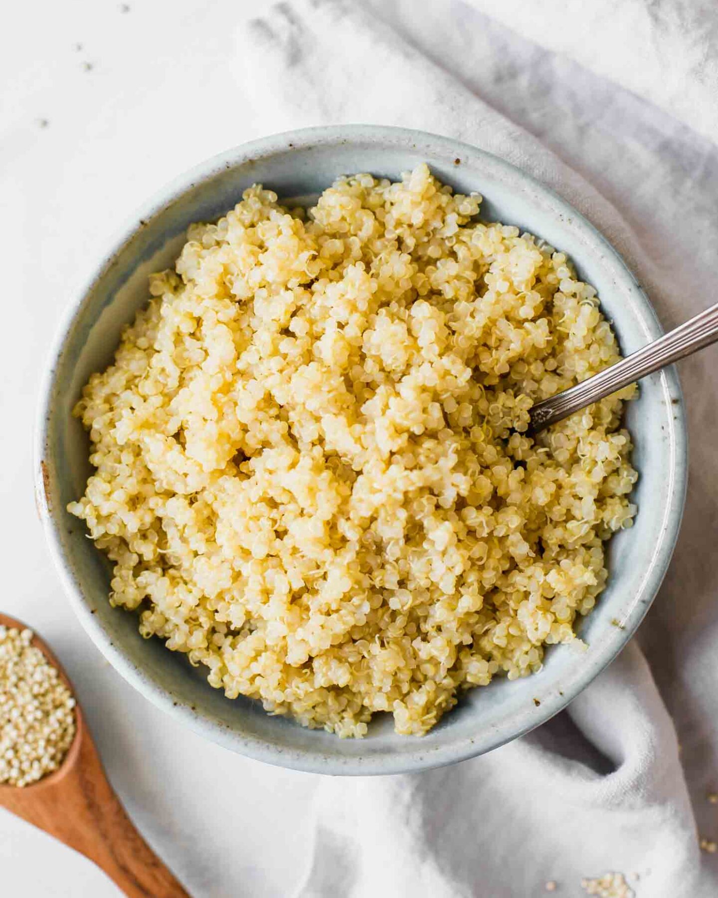 Perfectly fluffy quinoa in a bowl with a fork.