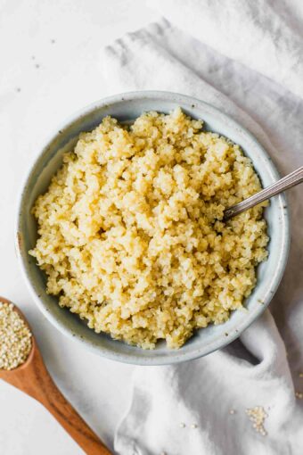 Perfectly fluffy quinoa in a bowl with a fork.