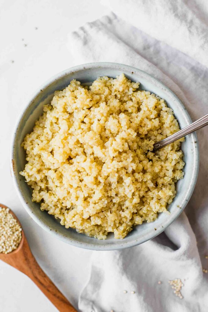 Perfectly fluffy quinoa in a bowl with a fork.