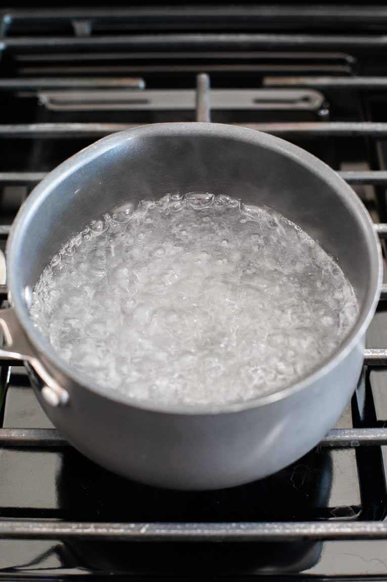 Pot of hot water boiling.