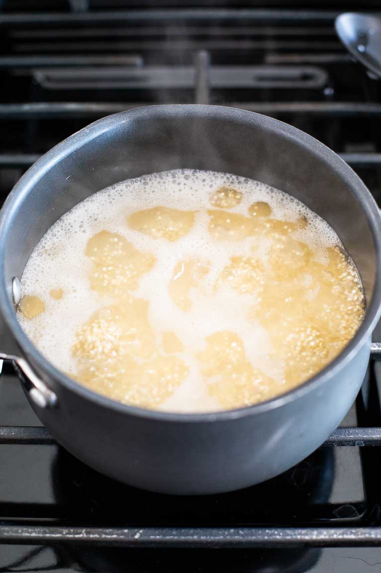 Quinoa in a pot of boiling water.