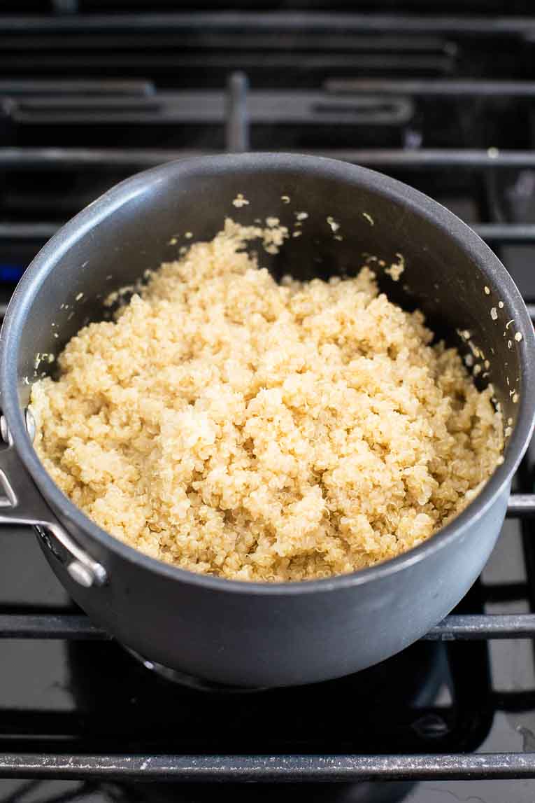 Cooked quinoa in a stock pot.