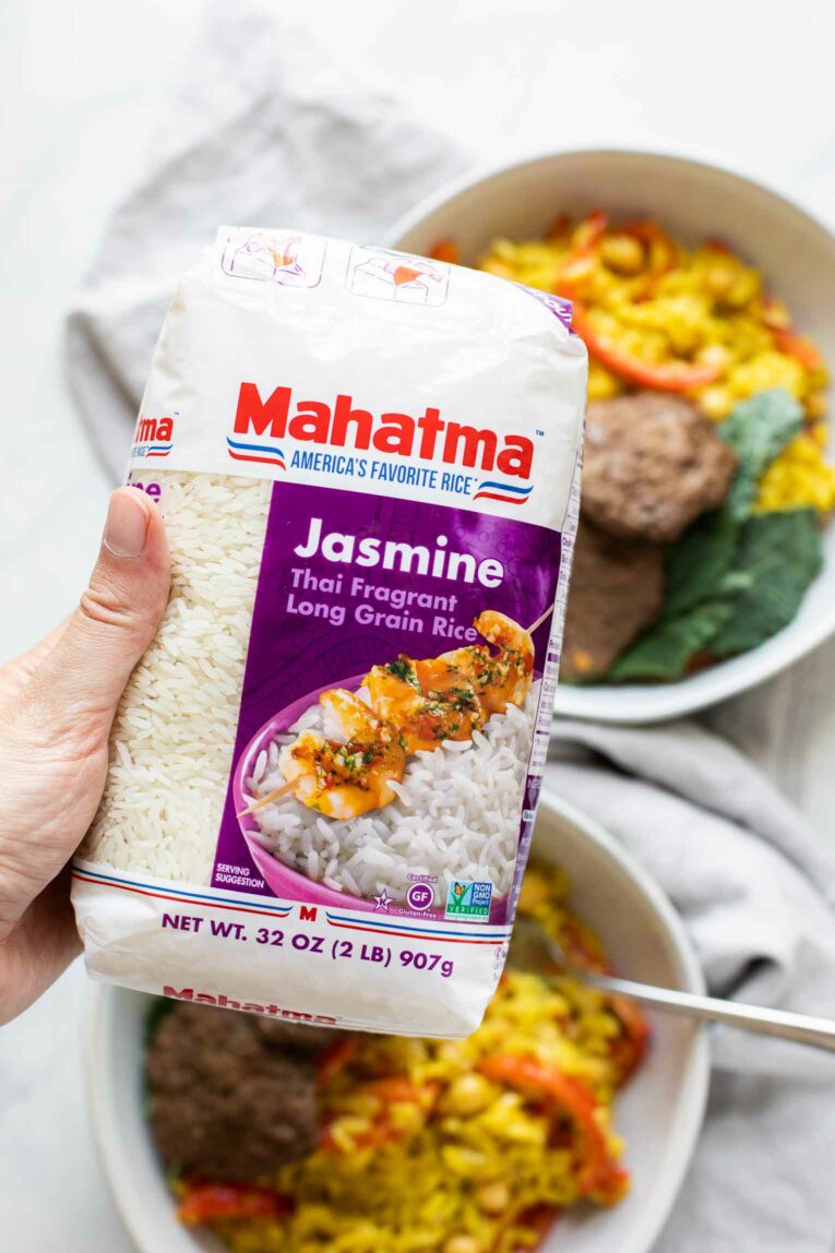 Close up of hand holding Mahatma Rice.