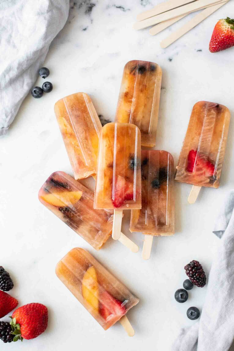 Top shot of Lemon Sweet Tea Popsicles on a marble board.
