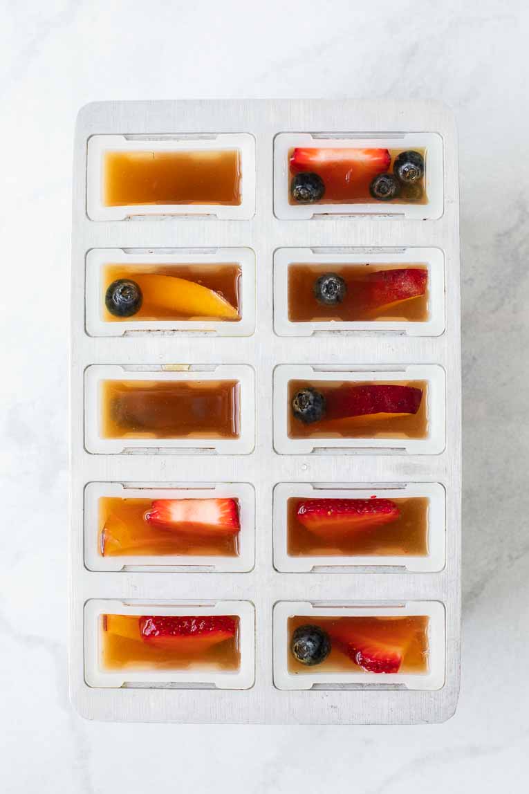 Top shot of sweet tea popsicles in a popsicle mold.