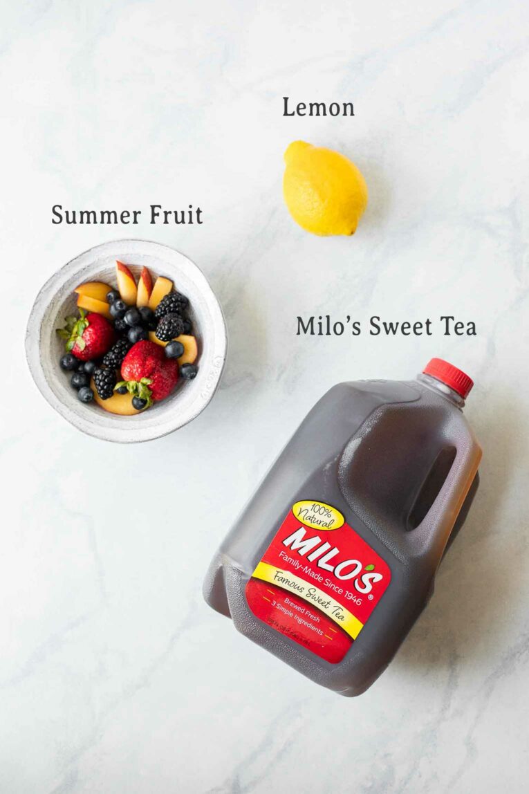 Ingredients for Lemon Sweet Tea Popsicles on a marble board.
