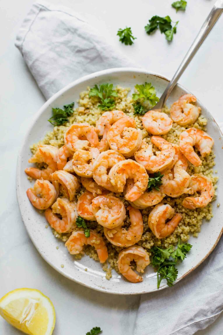 Easy Lemon Garlic Shrimp served over quinoa with fresh parsley.