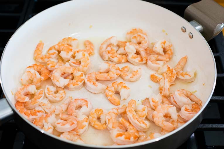 Shrimp cooking in a sauce pan.